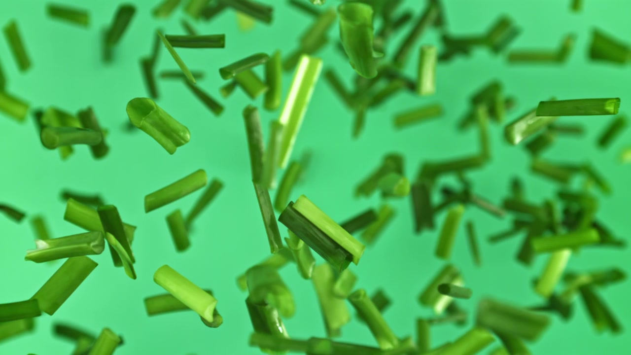 Fresh Chopped Chives Falling in Slow Motion
