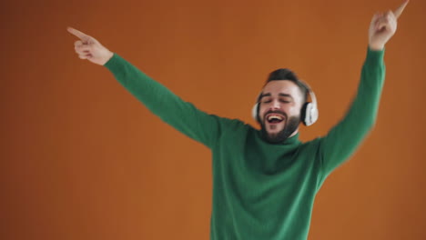 man dancing and listening to music