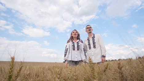 a beautiful ukrainian couple in embroidered shirts and with a flag in the middle of a wheat field a beautiful ukrainian couple in embroidered shirts and with a flag in the middle of a wheat field ukrainian patriots