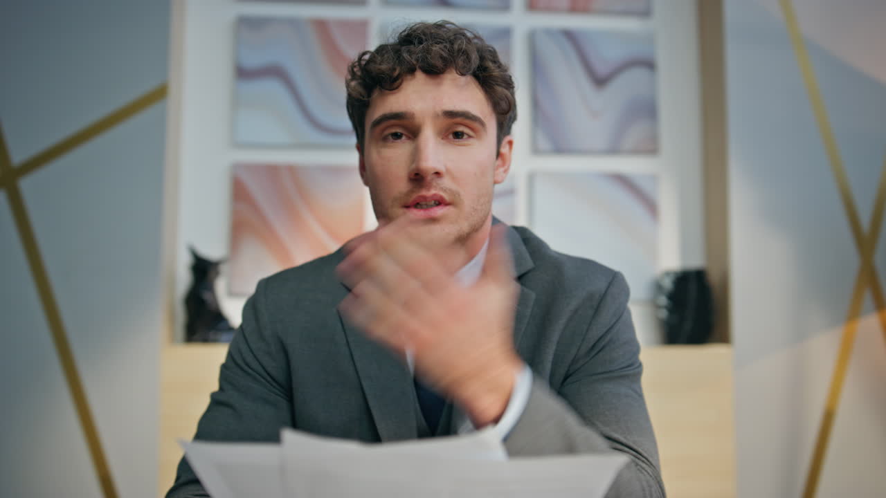 Confident businessman making videocall office closeup. Online teacher explaining