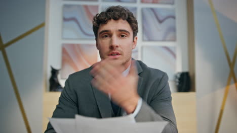 confident businessman making videocall office closeup. online teacher explaining