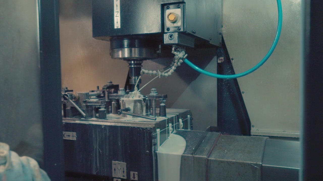 Milling modern machine cutting metal in a cnc factory, Ukraine.
