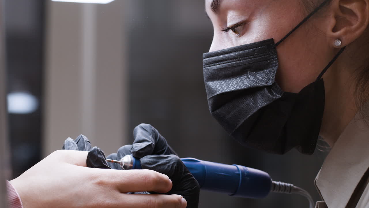 Nail Technician Performing a Manicure