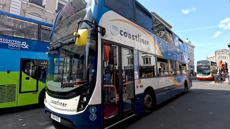 buses and people on a busy brighton street