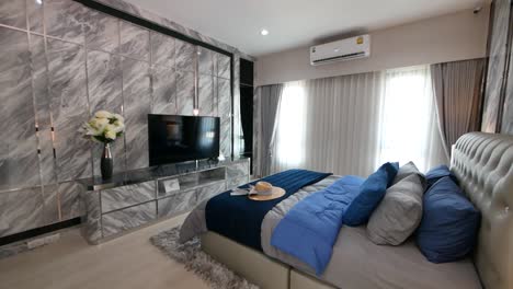 Modern-and-Luxury-Master-Bedroom-with-Marble-Tiles-Wall-Decoration