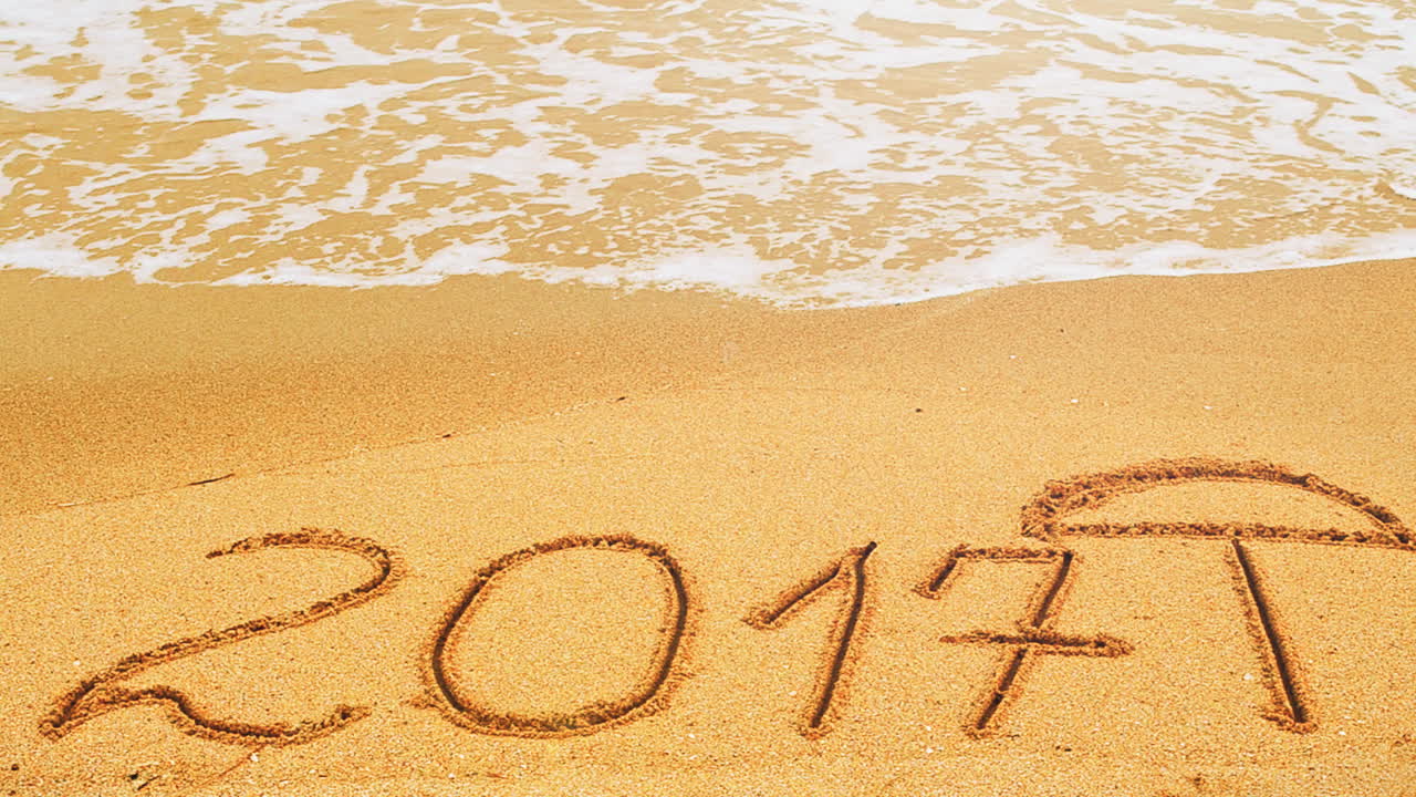 2017 in the form of an inscription on sand, the beach. Shooting on the beach