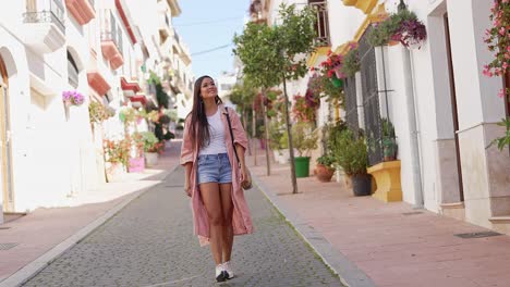 woman walking through a charming spanish town