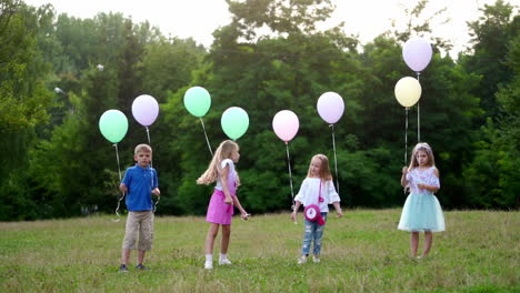 group of happy children playfully running with multicolored balloons