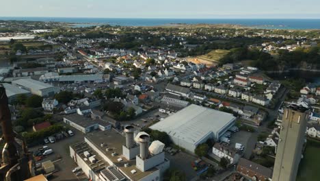 360-degree-aerial-pan-showing-St-Sampson-and-Vale,-Guernsey-including-Bordeaux,-Vale-Castle,the-harbour-and-urbanisation-and-surrounding-industry,Herm,Jethou-Sark-and-St-Peter-Port-in-the-distance