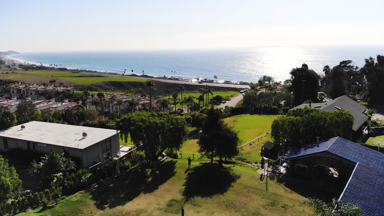 A drone shot of the coast line from the Malibu hills.