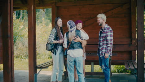 happy woman hugging tourists friends at vacation