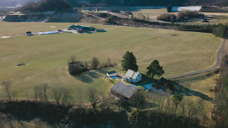 Aerial-View-Of-Vast-Field-Landscape-With-Farmhouses