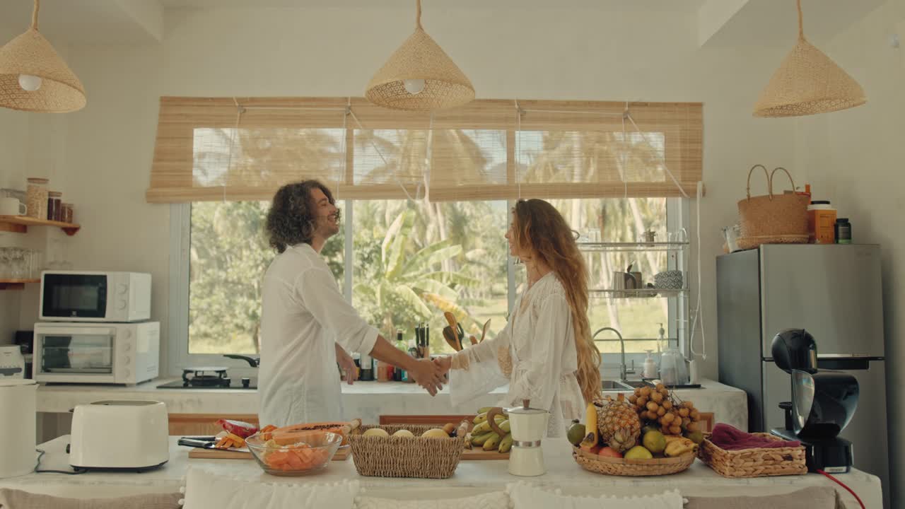 Couple Dancing in a Tropical Kitchen