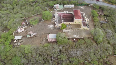 Aerial-approach-to-the-old-plantation-complex-with-neo-classicist-building-Landhuis-Hermanus-from-XIX-century