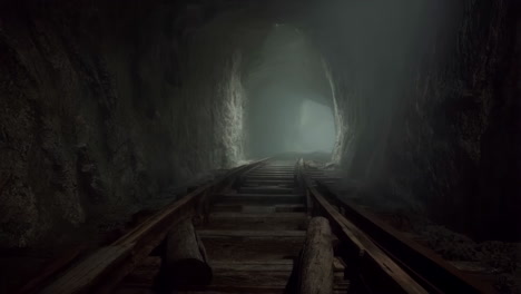 dark tunnel with train tracks