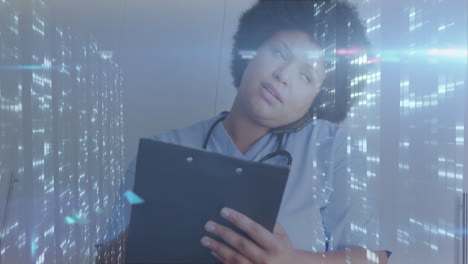 holding clipboard, healthcare professional viewing digital data processing animation overlay