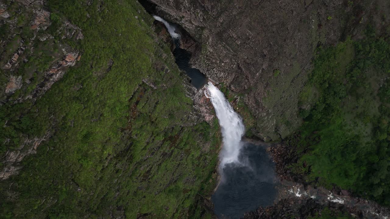 Aerial looks down onto tall, steep Casca D'anta waterfall in Brazil