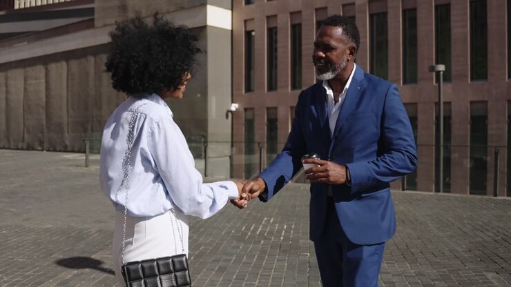 Business people shaking hands in the city