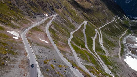 enjoy breathtaking aerial footage captured by an drone as it glides over the impressive alpine landscape and scenic mountain roads