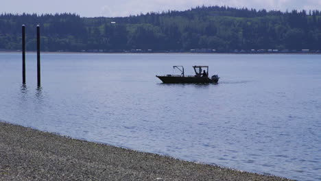 small, nondescript fishing floating near dock at camano island state park, wa state 20sec-24fps slow motion