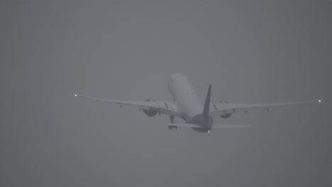 plane taking off during a storm