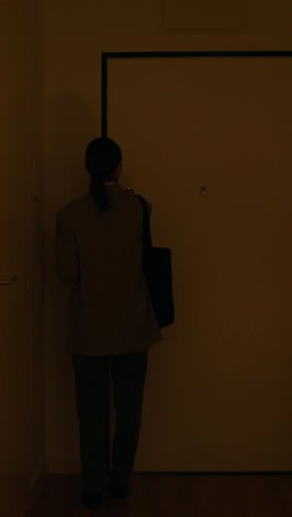 woman walking through a home hallway