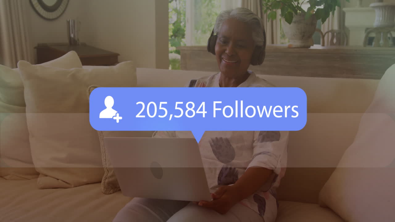 Using laptop, elderly woman receiving 205,584 followers notification in animation