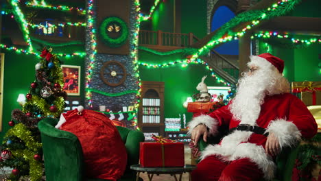 santa claus sitting in a cozy christmas scene