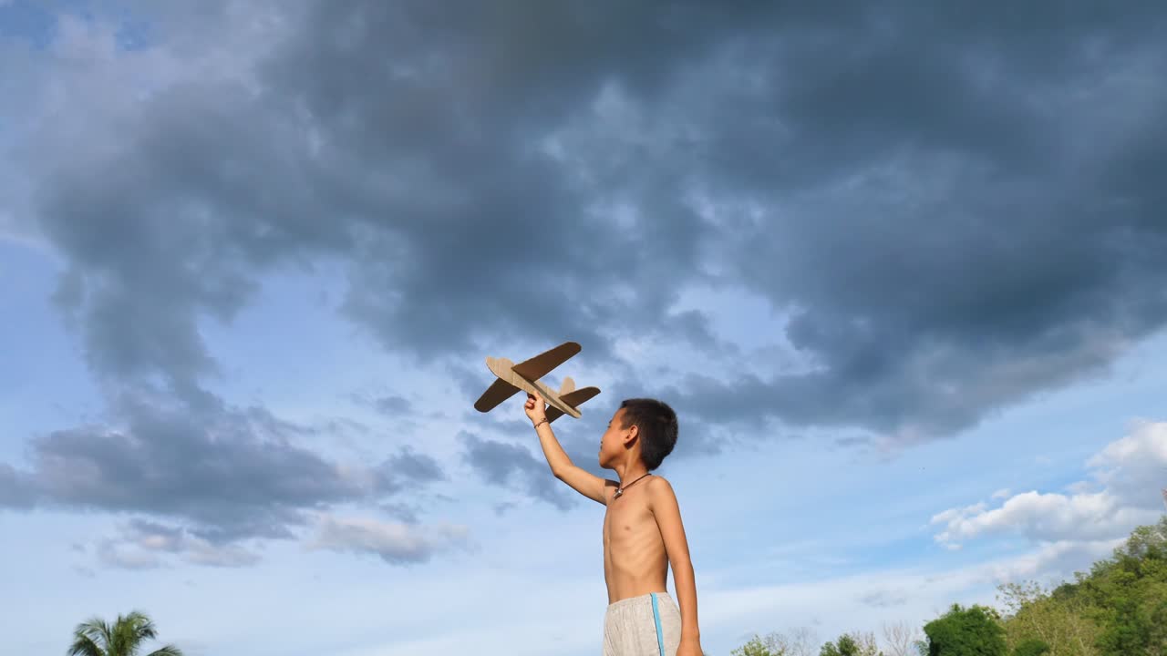Boy Playing with a Paper Airplane