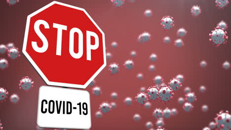 animation of falling covid 19 cells over stop sign