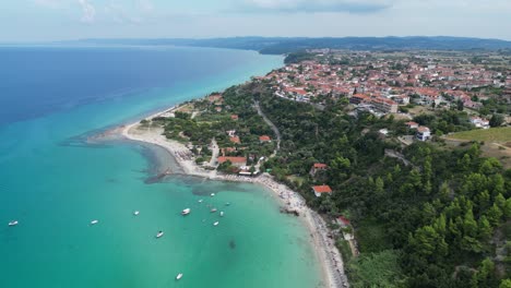 Afytos-Beach,-Village-and-Coastline-in-Kassandra,-Halkidiki,-Greece---Aerial-4k