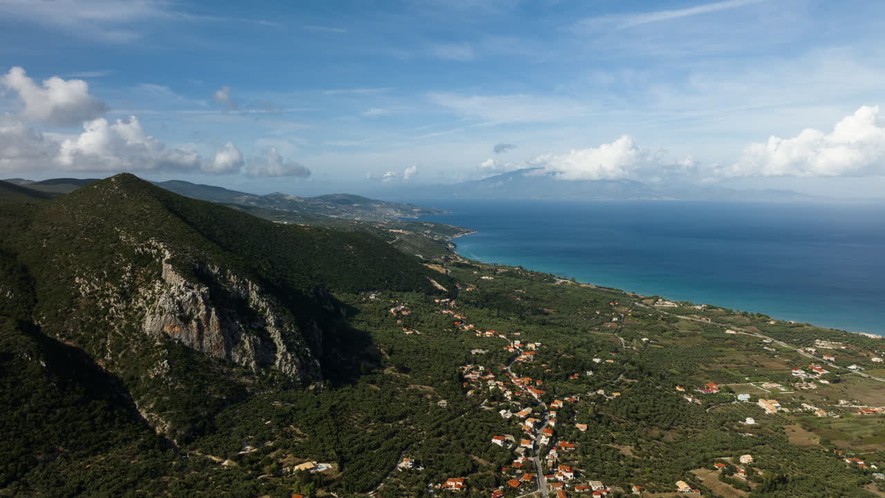 Aerial View of Coastal Village and Mountains