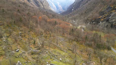 retreating drone shot of a village of stone houses in the district of vallemaggia, canton of ticino, switzerland