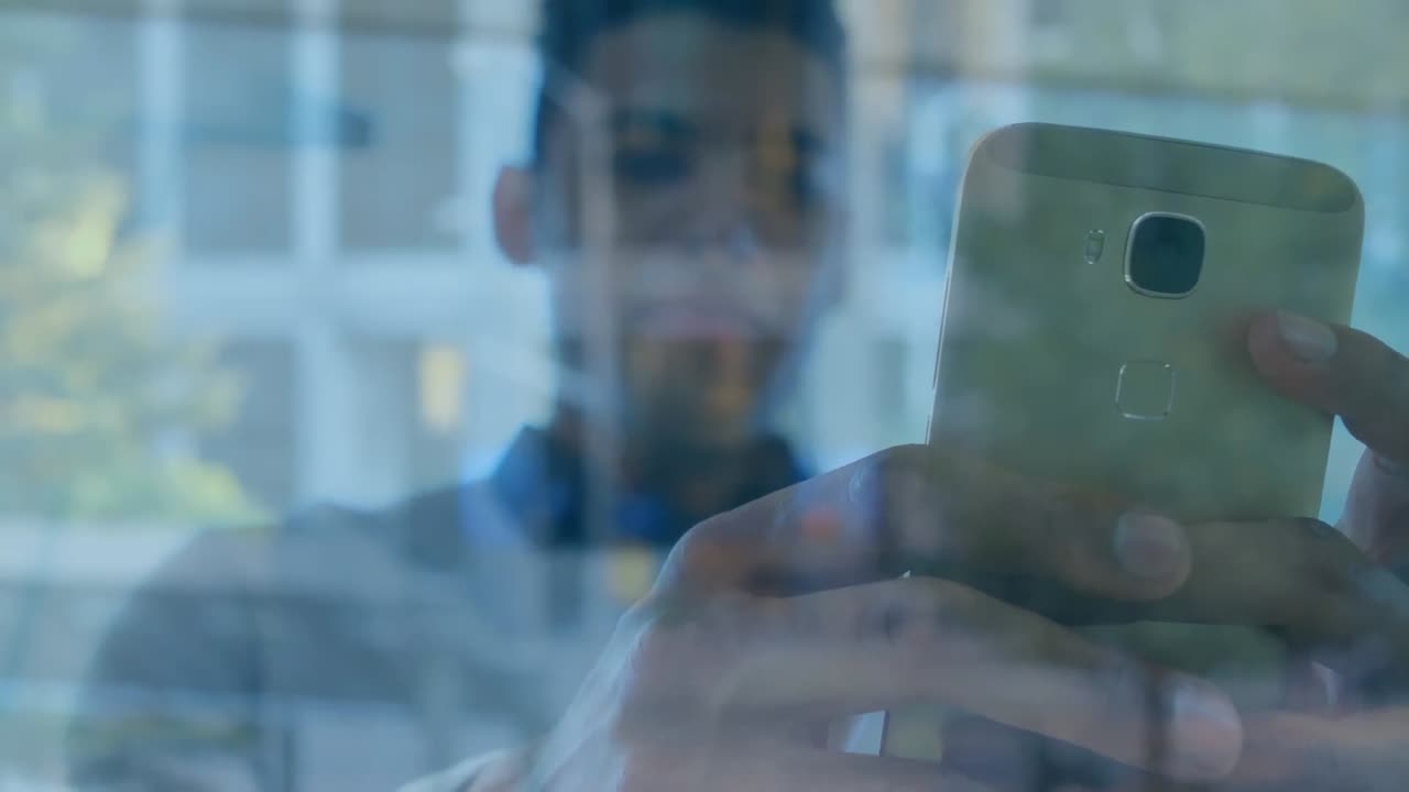 Animation of man using smartphone over cityscape