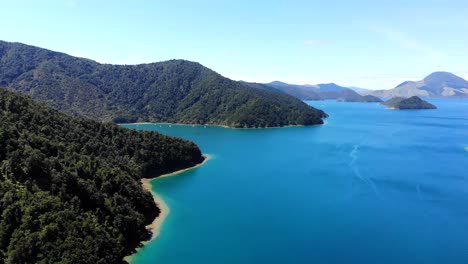 flyover of the coast line at penzance bay in the marlborough sounds on a summers day