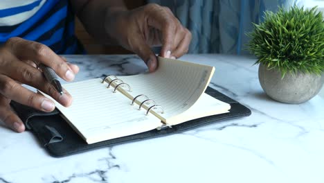 person reading a notebook