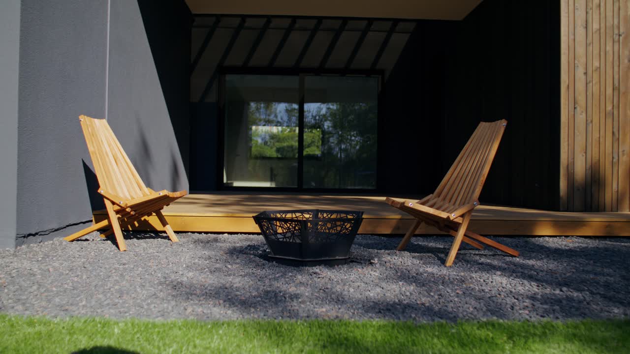 Outdoor Patio with Fire Pit and Wooden Chairs