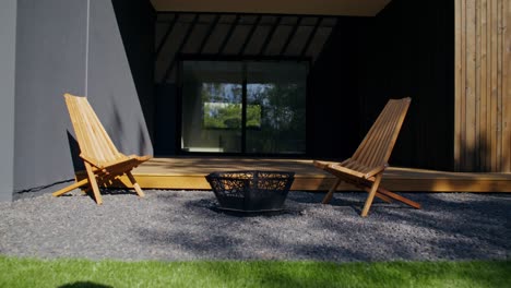 outdoor patio with fire pit and wooden chairs