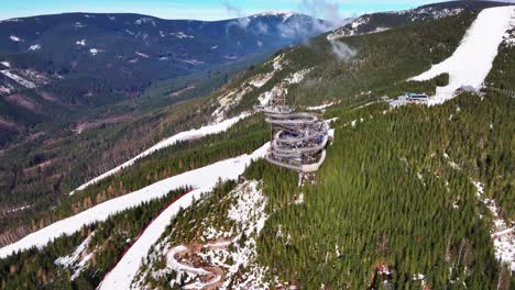 Aerial-view-of-sky-walk-attraction-tower-at-Dolni-Morava-mountain-range