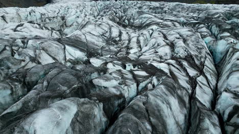 across glacier crevices, surface of ice caps, natural attraction, aerial shot