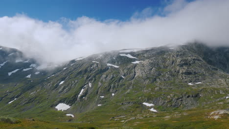 Ride-Near-The-Picturesque-Mountain-Landscape-Of-Norway-Drive-Past-A-Lone-Wooden-House-View-From-Car-