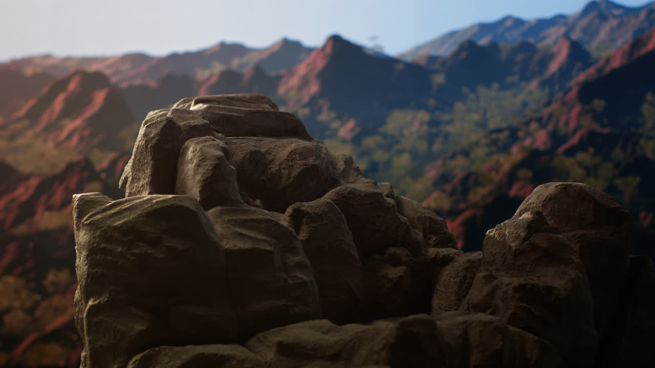 vista panorámica de una impresionante cordillera con terreno rocoso en primer plano