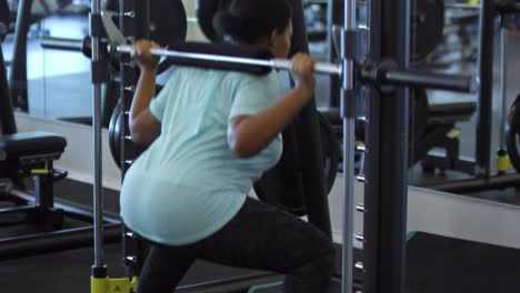 black woman training with smith machine