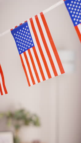 vertical video close up of american stars and stripes flag bunting for party celebrating 4th july independence day 2