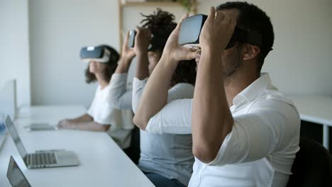 Slow motion shot of testers wearing VR glasses