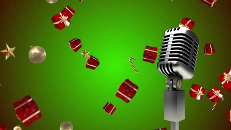 Animation-of-microphone-over-presents-at-christmas-on-green-background