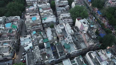 4K-Aerial-Shots-of-New-Delhi-Residential-Suburbs-on-a-beautiful-day-gliding-over-Rooftops,-streets,-parks-and-markets-in-India