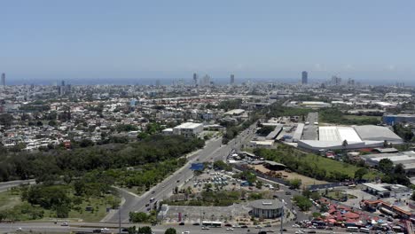 juan pablo duarte highway with skyscrapers and sea in background, santo domingo in dominican republic