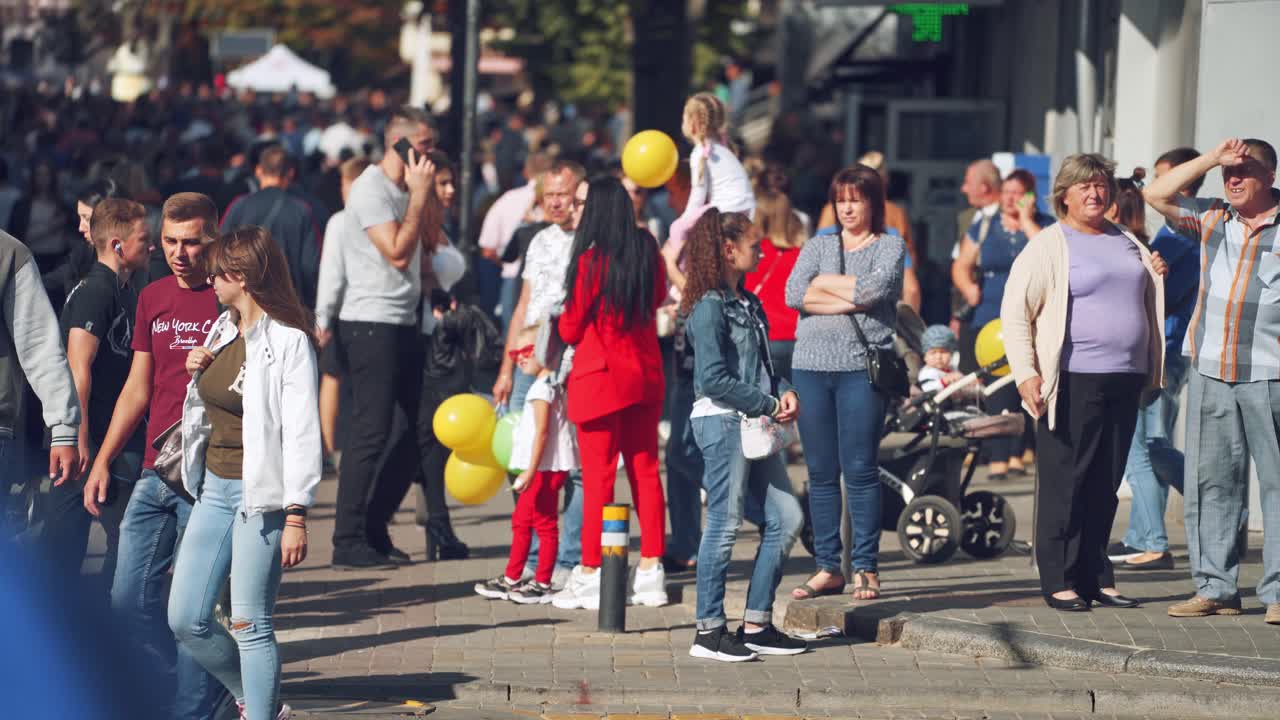 Crowd of people walking on streets. People walking against urban landscape