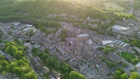 Extended-slow-moving-raising-shot-of-todmorden-town-centre-featuring-the-famous-town-hall-,-at-sunset-on-an-midweek-evening